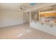 Open-concept living area with tile flooring, light walls, and seamless flow into the kitchen at 15610 N 98Th Ave # 26, Sun City, AZ 85351