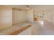 Spacious living room with neutral carpet flooring and ceiling fans at 15610 N 98Th Ave # 26, Sun City, AZ 85351