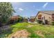 Backyard featuring grass, garden, patio, and home exterior at 16605 W Pierce St, Goodyear, AZ 85338