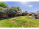 Backyard featuring grass, garden, and patio area at 16605 W Pierce St, Goodyear, AZ 85338