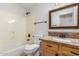 Bathroom featuring granite counters, framed mirror, vanity and bathtub at 16605 W Pierce St, Goodyear, AZ 85338