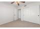 Bedroom with neutral carpet and ceiling fan at 16605 W Pierce St, Goodyear, AZ 85338