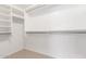 A walk-in closet with shelves and clothing rods provides ample storage space at 16605 W Pierce St, Goodyear, AZ 85338