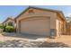 Neutral colored two-car garage attached to the home at 16605 W Pierce St, Goodyear, AZ 85338