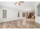 Open-concept living room flows into a kitchen with an island and stainless steel appliances at 16605 W Pierce St, Goodyear, AZ 85338