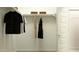 Well-organized closet with hanging clothes, overhead shelving, and a clean, minimalist design at 17375 W Whispering Wind Rd, Surprise, AZ 85387