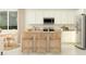 Bright kitchen with white cabinets, stainless steel appliances, and a countertop island with bar stool seating at 17375 W Whispering Wind Rd, Surprise, AZ 85387