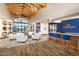 Elegant lobby with high ceilings, stylish furniture, and a reception area with a blue accent wall at 17375 W Whispering Wind Rd, Surprise, AZ 85387