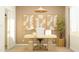 Bright home office with a modern desk, stylish artwork, and ample natural light at 17375 W Whispering Wind Rd, Surprise, AZ 85387