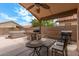 Outdoor patio features a bar, hot tub, barbeque, tables and chairs at 1770 W Browning Way, Chandler, AZ 85286