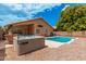 Exterior shot of the backyard featuring a pool, hot tub and desert landscaping at 1770 W Browning Way, Chandler, AZ 85286