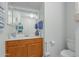 Bathroom with wood-look vanity and a single sink, plus towel rack and toilet in view at 1770 W Browning Way, Chandler, AZ 85286