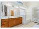 Bright bathroom features a double vanity, soaking tub, and natural light from a skylight at 1770 W Browning Way, Chandler, AZ 85286