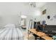 Bright bedroom featuring tiled floors, a workspace, and an open doorway to another room at 1770 W Browning Way, Chandler, AZ 85286
