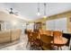 Open-concept dining area with large wooden dining table and comfortable seating. Features lots of light at 1770 W Browning Way, Chandler, AZ 85286