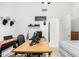 Bright home office with a large desk, and neutral color palette at 1770 W Browning Way, Chandler, AZ 85286