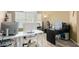 Bright home office with large windows, laminate wood floors, and ample desk space at 1770 W Browning Way, Chandler, AZ 85286