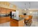 Spacious kitchen featuring stainless steel appliances, granite countertops and a dining table at 1770 W Browning Way, Chandler, AZ 85286