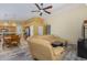 Cozy living room features a plush sectional sofa and a ceiling fan for added comfort at 1770 W Browning Way, Chandler, AZ 85286