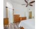The main bedroom is bright with wood laminate floors, a ceiling fan, and closet access at 1770 W Browning Way, Chandler, AZ 85286
