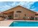 Backyard shot of a sparkling blue private pool and covered patio area at 1770 W Browning Way, Chandler, AZ 85286