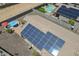 Home aerial view with solar panels, pool, and landscaping at 1813 N Lewis Pl, Casa Grande, AZ 85122