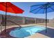 Backyard with built-in hot tub, sunshades, and privacy wall creating a relaxing atmosphere at 1813 N Lewis Pl, Casa Grande, AZ 85122