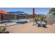 Backyard features a relaxing spa and a seating area perfect for entertaining guests at 1813 N Lewis Pl, Casa Grande, AZ 85122