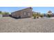 Spacious backyard with gravel landscaping, pool, and patio, perfect for outdoor entertaining at 1813 N Lewis Pl, Casa Grande, AZ 85122
