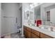 Bathroom with double sinks and a large mirror, providing convenience and functionality at 1813 N Lewis Pl, Casa Grande, AZ 85122