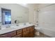 Bathroom with double sinks, ample counter space, and a shower-tub combination at 1813 N Lewis Pl, Casa Grande, AZ 85122