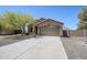 Charming single-Gathering home with mature landscaping and an inviting driveway at 1813 N Lewis Pl, Casa Grande, AZ 85122
