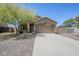 Beautiful single-story home with a two-car garage, a desert landscaped yard, and neutral color palette at 1813 N Lewis Pl, Casa Grande, AZ 85122