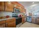 Well-equipped kitchen with stainless steel appliances, ample counter space and modern design at 1813 N Lewis Pl, Casa Grande, AZ 85122