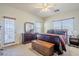 Bright bedroom with large windows, and a dresser, providing plenty of natural light at 1813 N Lewis Pl, Casa Grande, AZ 85122