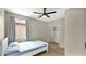 Bedroom featuring a bed with a closet, a window with curtains and carpet floors at 18371 W Sunrise Dr, Goodyear, AZ 85338