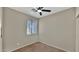 Bedroom featuring a window with a blind, carpet floors and ceiling fan at 18371 W Sunrise Dr, Goodyear, AZ 85338