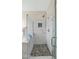 Stylish bathroom featuring marble shower with a glass door and modern fixtures at 18371 W Sunrise Dr, Goodyear, AZ 85338