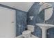 Small bathroom featuring pedestal sink, toilet and blue textured walls at 1898 E Kent Ave, Chandler, AZ 85225
