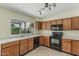 Well-lit kitchen features white countertops, tile floors, and wooden cabinets at 1898 E Kent Ave, Chandler, AZ 85225