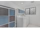 Laundry room with storage shelves, a patterned window, and a washer and dryer at 1898 E Kent Ave, Chandler, AZ 85225