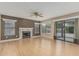 Bright living room featuring hardwood floors, a fireplace, and sliding door to the patio at 1898 E Kent Ave, Chandler, AZ 85225