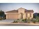 Charming single-story home featuring a tile roof and desert landscaping in the front yard at 21270 E Cattle Dr, Queen Creek, AZ 85142