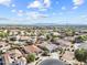 Aerial view of homes with pools, desert landscaping, and mountain backdrop at 22274 E Cherrywood Ct, Queen Creek, AZ 85142