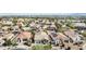 Detailed aerial perspective of residential properties featuring neat lawns, pool, and solar panels at 22274 E Cherrywood Ct, Queen Creek, AZ 85142