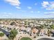 Extensive aerial shot of a neatly planned residential development with uniform terracotta roofs at 22274 E Cherrywood Ct, Queen Creek, AZ 85142