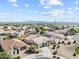 Aerial view of a residential neighborhood with well-maintained homes, mountain views, and desert landscape at 22274 E Cherrywood Ct, Queen Creek, AZ 85142