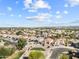 Extensive aerial scene of a residential area showing well-kept landscaping and curved streets at 22274 E Cherrywood Ct, Queen Creek, AZ 85142