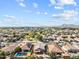 Bright aerial shot of a sprawling desert community with mountain views and neighborhood parks at 22274 E Cherrywood Ct, Queen Creek, AZ 85142