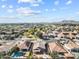Extensive aerial view of a desert community featuring well maintained landscaping and neighborhood parks at 22274 E Cherrywood Ct, Queen Creek, AZ 85142